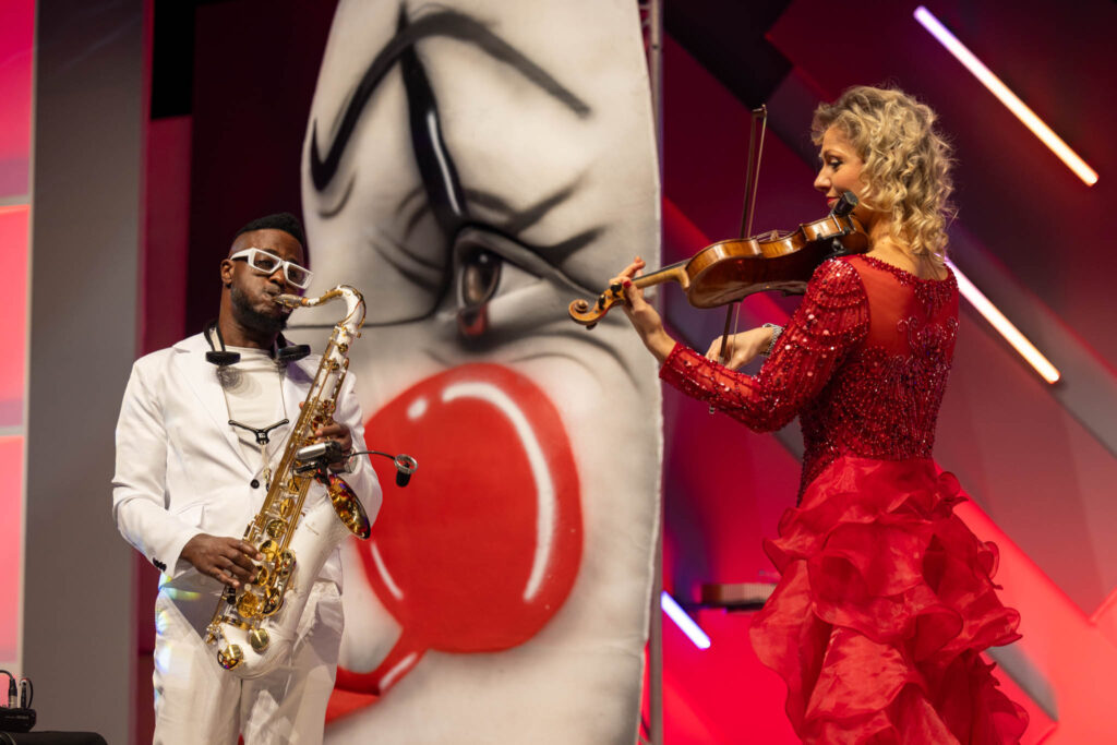 Live performers on stage at a Dominos corporate event